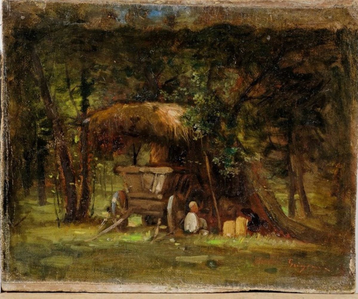 Căruță sub umbrar în pădure